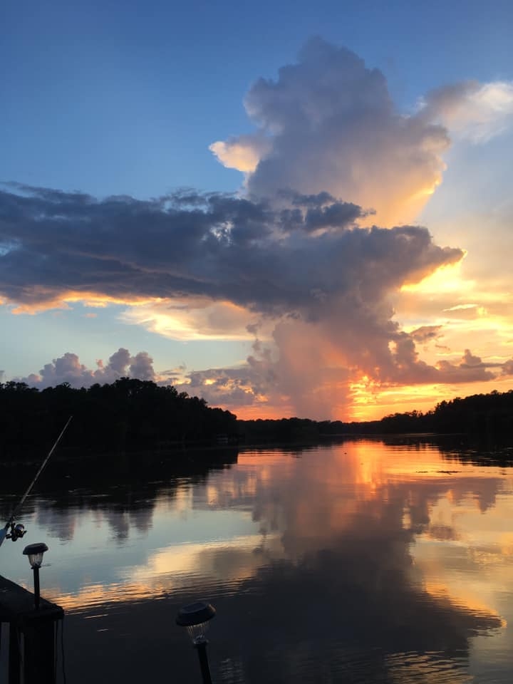 sunset-orange-fishing-pole-dock-clouds-selena-jones